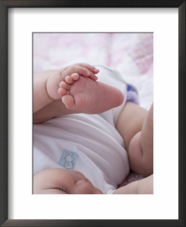 4 Month Old Baby Girl Holding Her Foot by Amanda Hall Pricing Limited Edition Print image