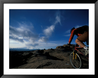 Mountain Biking On The Moab Slickrock Bike Trail, Navajo Sandstone, Utah, Usa by Jerry & Marcy Monkman Pricing Limited Edition Print image