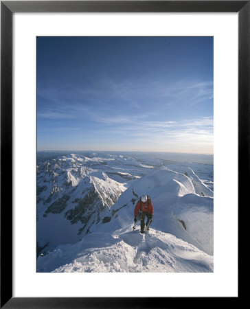 A Man Summits A Mountain In Grand Teton National Park, Wyoming by Jimmy Chin Pricing Limited Edition Print image