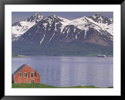 Small Farm Building With Mountains, Harstad, Norway by Walter Bibikow Pricing Limited Edition Print image