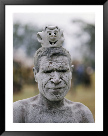 An Asaro Mudman Prepares To Dance At The Annual Tribal Sing-Sing Festival by Jodi Cobb Pricing Limited Edition Print image