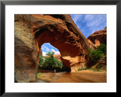Hiker Underneath Coyote Natural Bridge, Coyote Gulch Hike, Glen Canyon National Recreation Area by John Elk Iii Pricing Limited Edition Print image