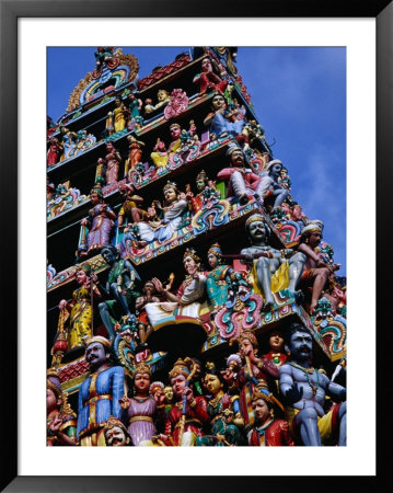 Colourful Hindu Figures Adorning The Gopuram At The Sri Mariamman Temple In Chinatown, Singapore by Glenn Beanland Pricing Limited Edition Print image