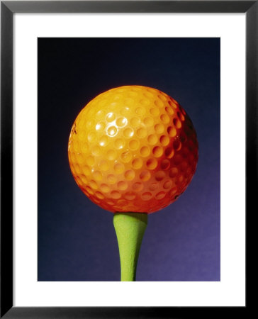 An Orange Golf Ball On A Green Tee With A Blue Background by Brian Gordon Green Pricing Limited Edition Print image