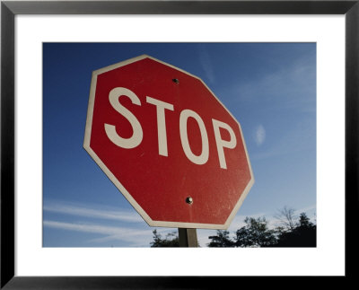 A Red Stop Sign Against A Blue Sky by Stephen St. John Pricing Limited Edition Print image