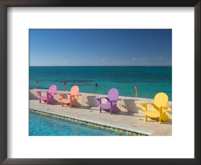 Colorful Pool Chairs At Compass Point Resort, Gambier, Bahamas, Caribbean by Walter Bibikow Pricing Limited Edition Print image