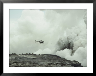 Helicopter Flies Over A Smoking Volcano In Hawaii by Paul Nicklen Pricing Limited Edition Print image