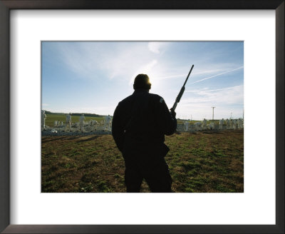 An Armed Guard Watches Over Inmates Working On A Chain Gang by Bill Curtsinger Pricing Limited Edition Print image