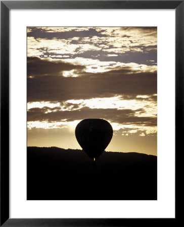The Silhouette Of A Hot Air Balloon And Jet Flame At Dawn, Australia by Jason Edwards Pricing Limited Edition Print image