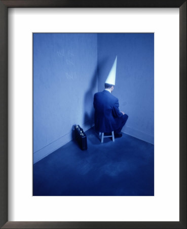 Businessman Sitting In Corner With Dunce Hat by Chuck Carlton Pricing Limited Edition Print image