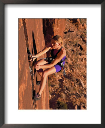 A Climber Scales A Sandstone Wall At Indian Creek, Utah by Bill Hatcher Pricing Limited Edition Print image
