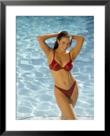 Woman In Red Bikini Posing By Pool by Stewart Cohen Pricing Limited Edition Print image