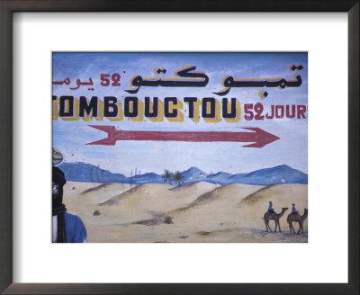 Colorful Sign Showing Way To Timbuktu, Morocco by John & Lisa Merrill Pricing Limited Edition Print image