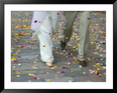 Newly Wed Couple Walk On Street With Flower Petals, Vilnius, Lithuania by Keren Su Pricing Limited Edition Print image