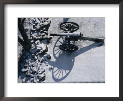 Fresh Snowfall Outlines A Cannon In This Winter View Of Gettysburg by Stephen St. John Pricing Limited Edition Print image