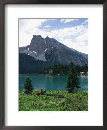 Horseback Riding Around Emerald Lake In Yoho National Park by Michael Melford Pricing Limited Edition Print image
