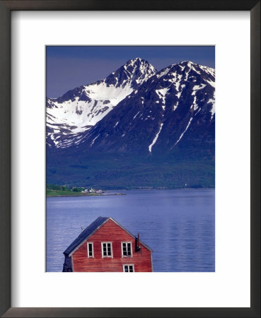 Small Farm Building And Mountains, Norway by Walter Bibikow Pricing Limited Edition Print image