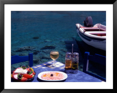 Seaside Table With Salad, Taramosalata, And Glass Of Retsina Wine, Loutro, South Crete, Greece by Steve Outram Pricing Limited Edition Print image