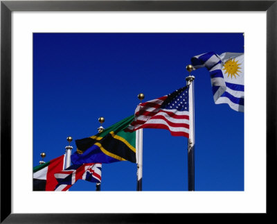 Flags Of Many Countries Fly Over The United Nations Building, New York City, New York, Usa by Greg Gawlowski Pricing Limited Edition Print image