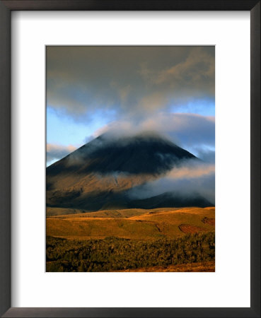 Clouds Over Volcano With Sunlit Plains In Foreground, Tongariro National Park, New Zealand by Johnson Dennis Pricing Limited Edition Print image