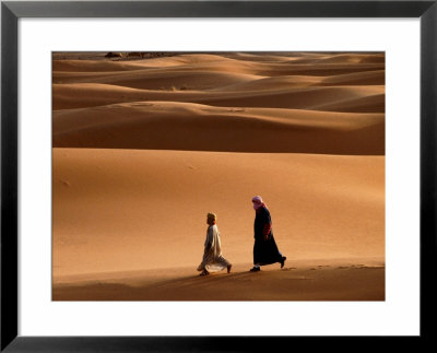 Men Walking Across Sand Dunes, Merzouga And The Dunes, Morocco by Izzet Keribar Pricing Limited Edition Print image