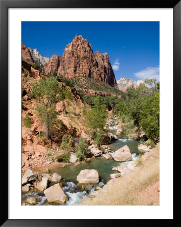 One Of The Patriarchs Looks Over The Zion River Tumbling Over Rocks by Taylor S. Kennedy Pricing Limited Edition Print image