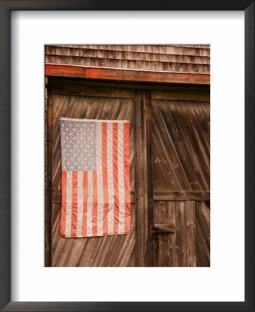 Faded American Flag On Old Barn Entrance, Maine, Usa by Joanne Wells Pricing Limited Edition Print image