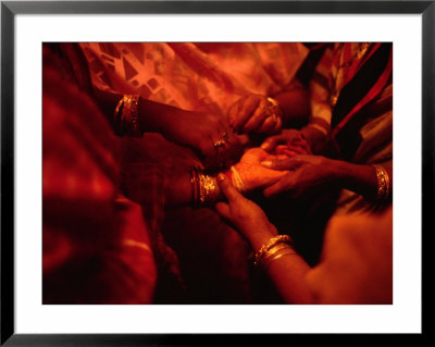 Hand Of Bride Being Held By Female Relatives During Wedding Ceremony, India by Richard I'anson Pricing Limited Edition Print image