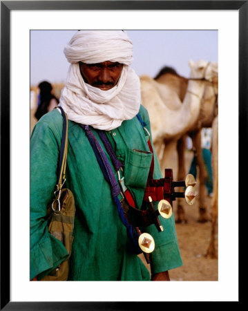 Tuareg Sword Salesman At Camel Market, Agadez, Niger by Pershouse Craig Pricing Limited Edition Print image