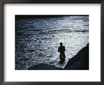 Silhouetted Man Bathing In The Colorado River At Twilight by Kate Thompson Pricing Limited Edition Print image