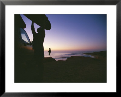 A Surfer Unloads A Board At Dawn In East Cape Of Baja, Mexico by Jimmy Chin Pricing Limited Edition Print image