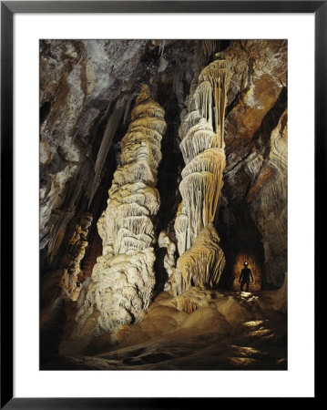 Giant Calcite Columns Stretch More Than 50 Feet To The Ceiling Of Tower Place In Lechuguilla Cave by Michael Nichols Pricing Limited Edition Print image