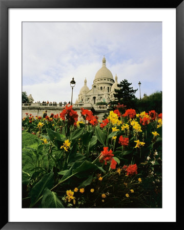 Red And Yellow Flowers Bloom In A Garden Near A Domed Building by Raul Touzon Pricing Limited Edition Print image