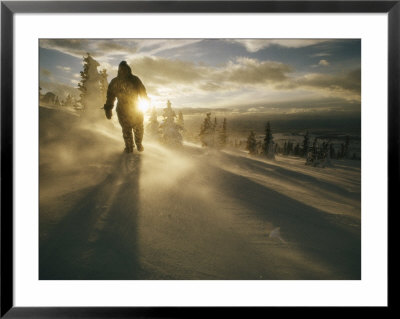 A Man Holding A Flashlight In A Snowy Landscape by Jonathan Blair Pricing Limited Edition Print image
