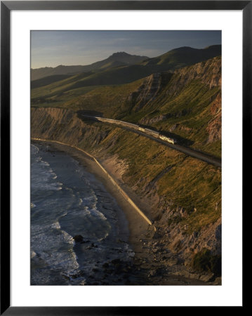 The Coast Starlight Train Snakes Past The Santa Ynez Mountains, California by Phil Schermeister Pricing Limited Edition Print image