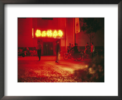 Motorcyclists Outside A Karaoke Bar With A Neon Sign In Hunan by Eightfish Pricing Limited Edition Print image