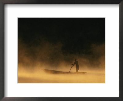Night Fisherman In A Dugout Canoe On The Zambezi River by Chris Johns Pricing Limited Edition Print image
