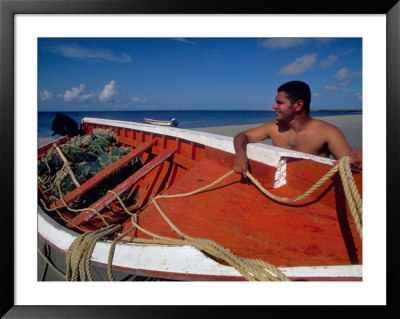 Fisherman Tends His Boat On The Beach, Isla Margarita, Venezuela by Greg Johnston Pricing Limited Edition Print image