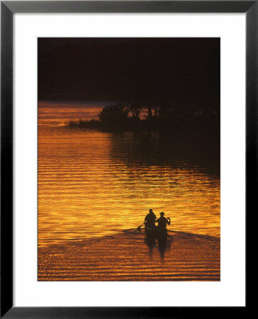 Canoers On Lake Metigoshe At Sunset, North Dakota, Usa by Chuck Haney Pricing Limited Edition Print image
