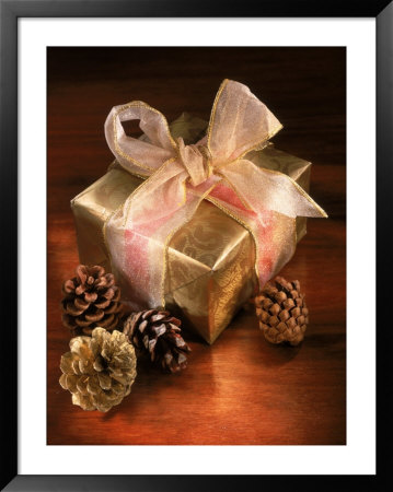 Christmas Gift With Gold Ribbon And Pinecones by Eric Kamp Pricing Limited Edition Print image