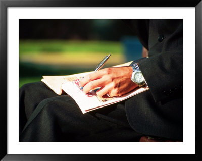 Businessman Writing On Newspaper by Stephen Umahtete Pricing Limited Edition Print image