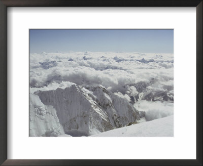 The Snow-Veiled Peaks Of The Himalayas Camouflaged By Clouds by Barry Bishop Pricing Limited Edition Print image