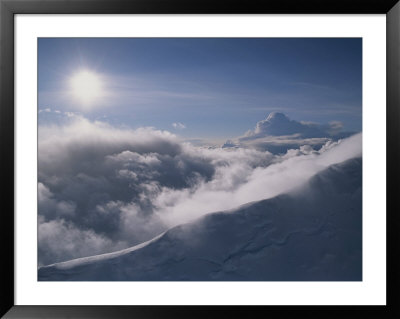 Sunlight Brightens Clouds Pouring Over Mount Capps by Rich Reid Pricing Limited Edition Print image