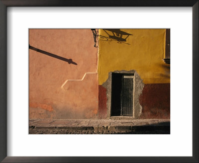 Shadows Cast On The Exterior Of A Colorfully Painted Stucco Building by Gina Martin Pricing Limited Edition Print image