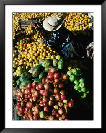 Fruit Vendor At Market Stall, Puno, Peru by Richard I'anson Pricing Limited Edition Print image