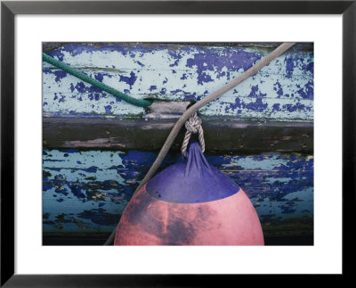 A Colorful Buoy Hangs From Ropes Off The Side Of A Boat by George F. Mobley Pricing Limited Edition Print image