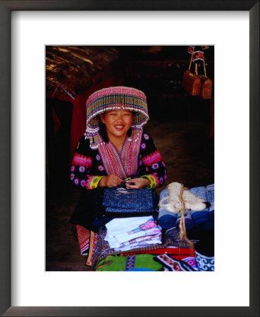 Hmong Village Woman Wearing A Tribal Hat At A Cloth Stall, Chiang Mai, Thailand by Ryan Fox Pricing Limited Edition Print image