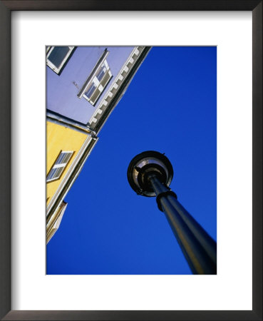 Street Lamp And Houses At Nyhavn, Copenhagen, Denmark by Martin Lladó Pricing Limited Edition Print image
