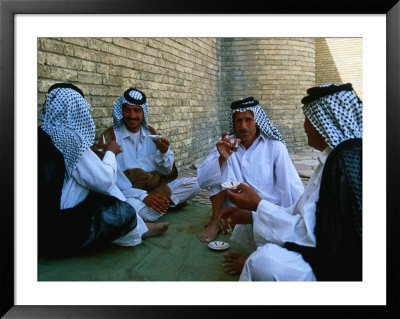 Men Drinking Tea Outside The Holy Shrine Of The Imam Ali Ibn Abi Talib, An Najaf, Iraq by Jane Sweeney Pricing Limited Edition Print image