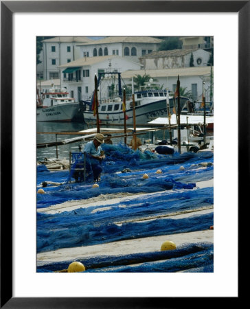 Fisherman Mending His Nets On Wharf, Port De Soller, Mallorca, Balearic Islands, Spain by Jon Davison Pricing Limited Edition Print image